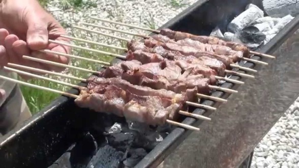 Brazier with lamb skewers
